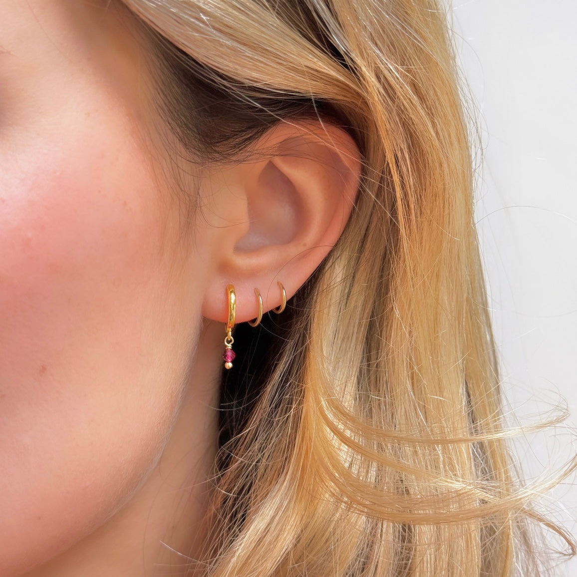Huggie Mini Hoop Earrings With Single Pink Garnet Drop