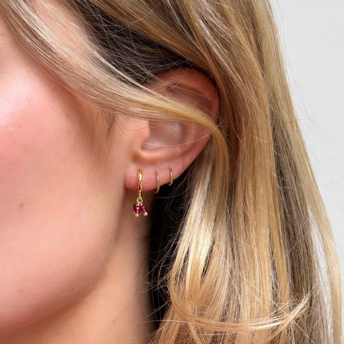 Huggie Mini Hoop Earrings With Triple Pink Garnet Drop